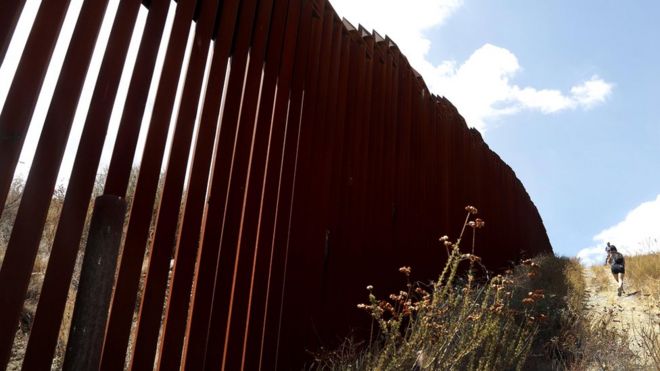 The border wall that bisects Tecate, Mexico and Tecate, California