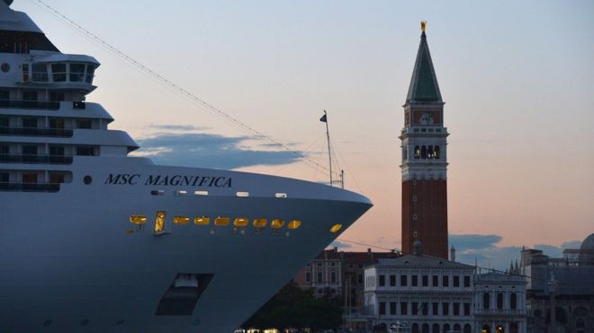 This file photograph taken on September 6, 2015 shows a cruise ship at sunset in Venice.