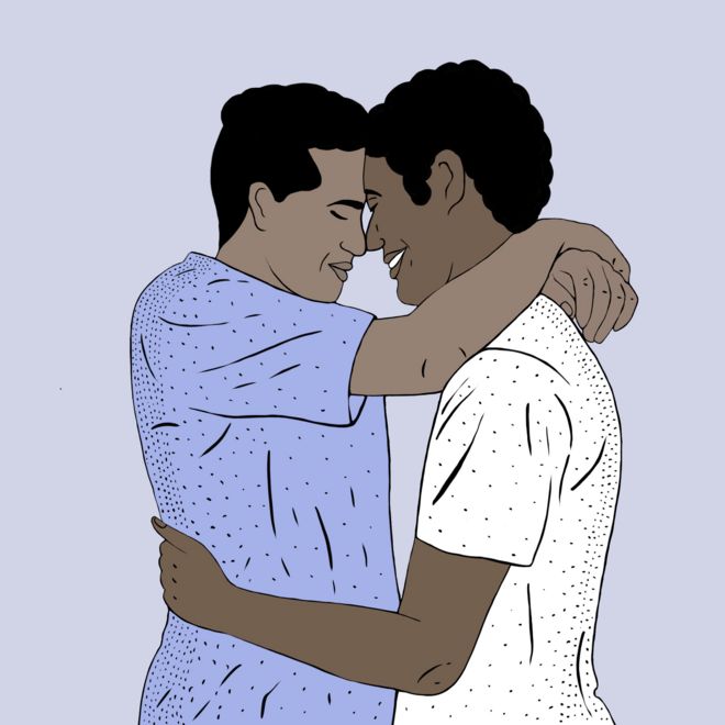 Young men embracing