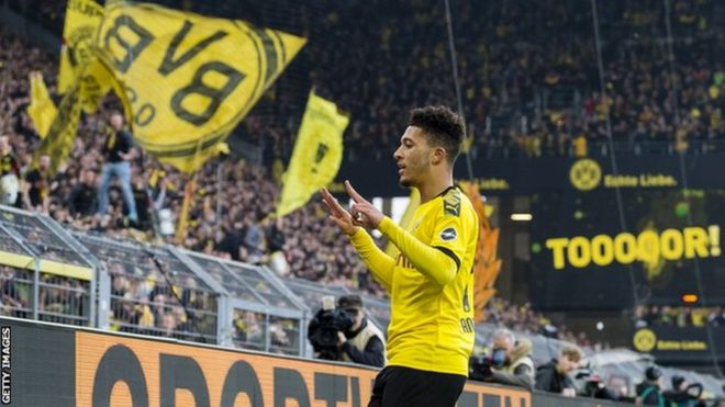 Jadon Sancho celebrates scoring