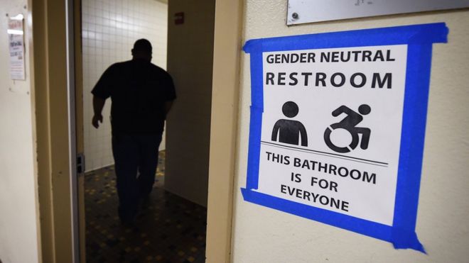 This file photo taken on May 4, 2016 shows signs posted outside the Santee High School"s gender neutral restrooms at their campus in Los Angeles, California.