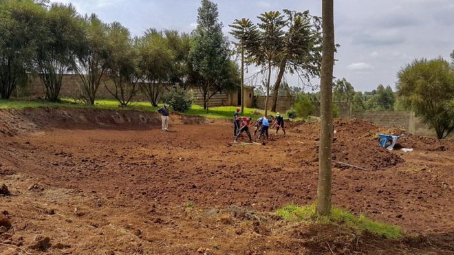 Workers building part of Ross and Haswell's golf green