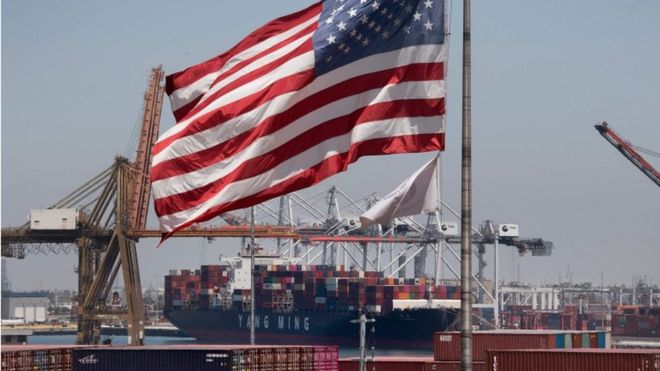 US flag and container ship at Long Beach, California, 1 August 2019