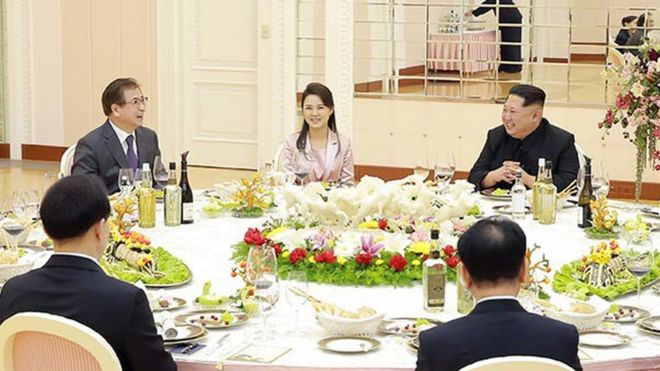 A handout photo made available by the South Korean Presidential Office shows the delegation at dinner