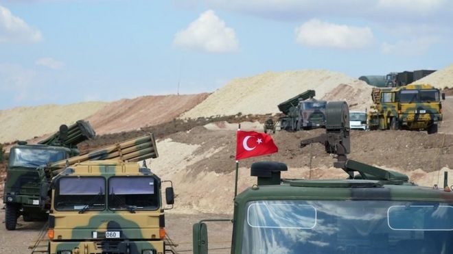 Handout photo made available by Turkish General Staff Press Office shows Turkish military vehicles as they cross into Idlib province, Syria (13 October 2017)