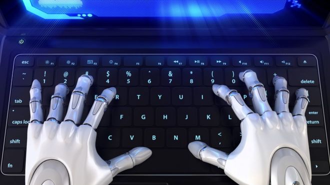 Robot hands on laptop keyboard