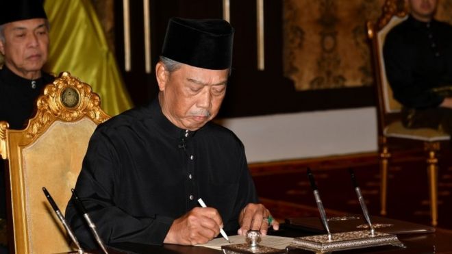 Muhyiddin Yassin is sworn in by the king