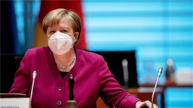 German Chancellor Angela Merkel wears a protective face mask before the weekly cabinet meeting of the German government