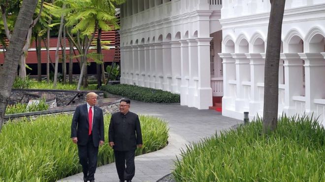 U.S. President Donald Trump walks with North Korean leader Kim Jong Un at the Capella Hotel on Sentosa island in Singapore June 12, 2018. Kevin Lim/The Straits Times via REUTERS ATTENTION EDITORS