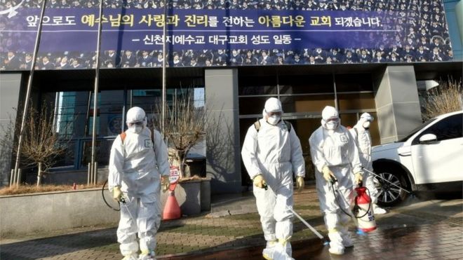 Workers spray disinfectant in front of the Daegu branch of the Shincheonji Church of Jesus, the Temple of the Tabernacle of the Testimony. Photo: 19 February 2020