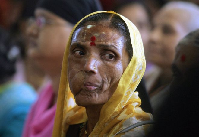 Indian cancer affected woman attends an International Women's Day celebration for patients of the Cancer Patients Aids Association in Mumbai, 08 March 2006.