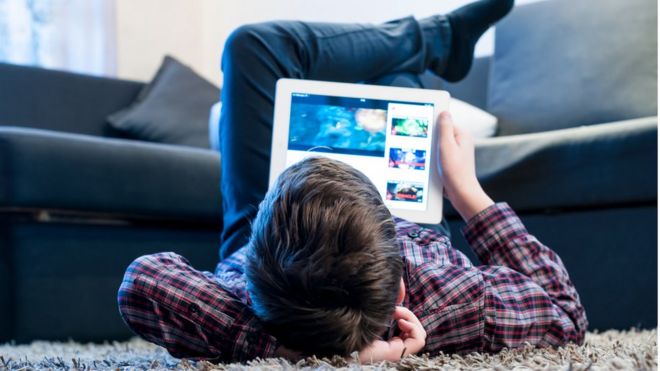 Teen watching videos on device