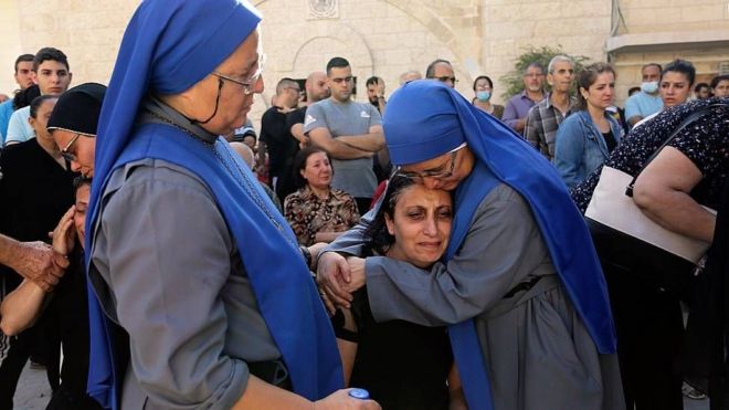 Nuns console bereaved Palestinians