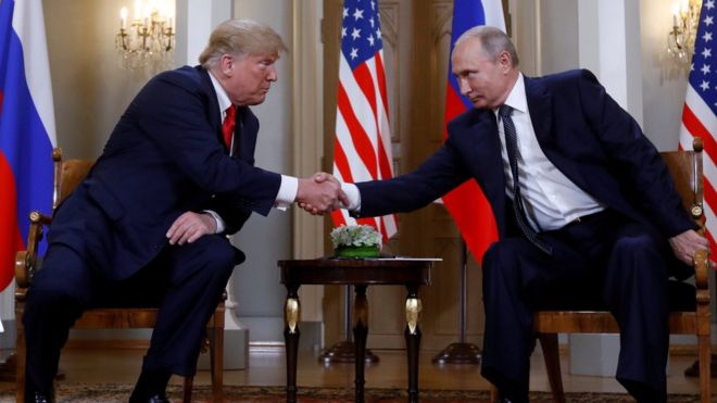 US President Donald Trump and Russia's President Vladimir Putin shake hands as they meet in Helsinki, Finland July 16, 2018