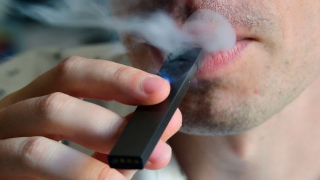 Man smoking with vape pen