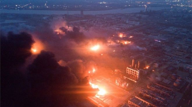 Overhead view of the Tianjiayi Chemical plant o­n fire with smoke billowing