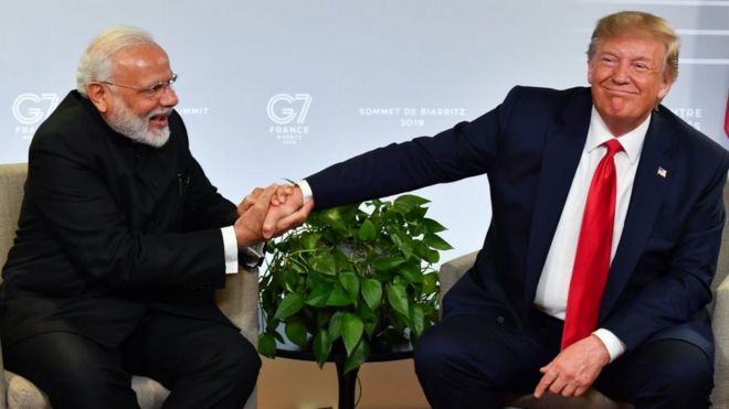 Indian Prime Minister Narendra Modi (L) and US President Donald Trump shakes hands as they speak during a bilateral meeting in Biarritz, south-west France on August 26, 2019.