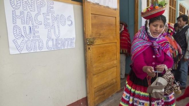 A woman votes in legislative elections in Peru, 26 January 2020