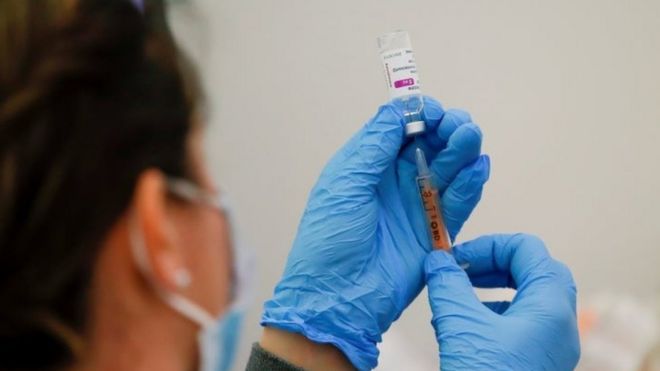 A dose of the AstraZeneca Covid-19 vaccine is prepared in a vaccination centre