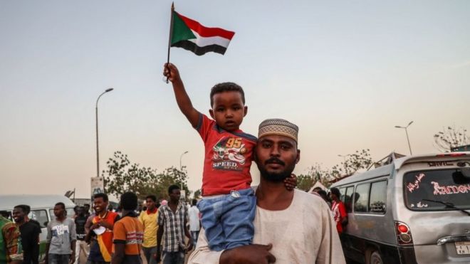 Sudanese demonstrators gather in front of military headquarters during a demonstration after The Sudanese Professionals Association's (SPA) call, demanding a civilian transition government, in Khartoum, Sudan on 22 April 2019.