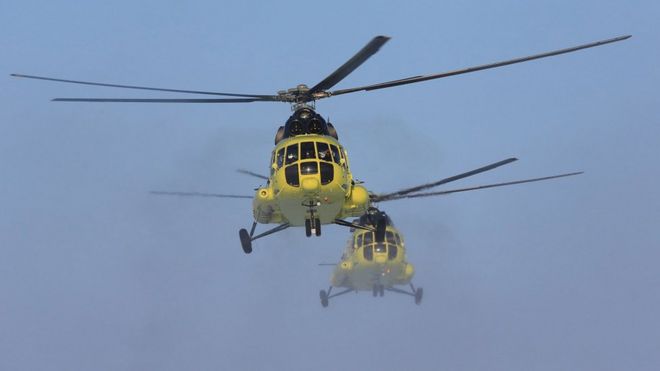 Handout photo showing two MI-8 helicopters belonging to Utair