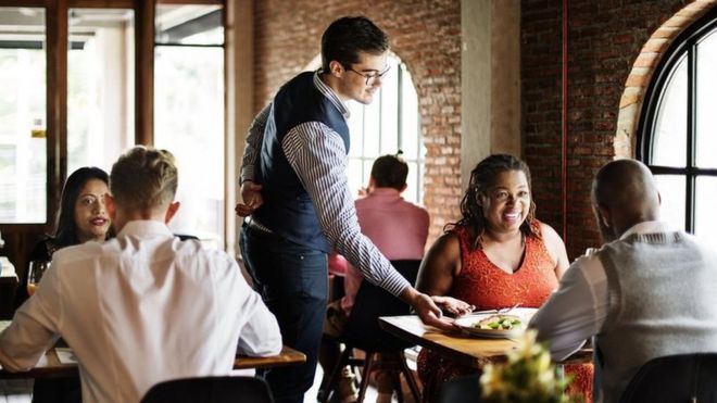 A restaurant with tables well spaced