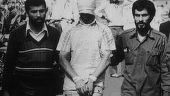 An American hostage being paraded before the cameras by his Iranian captors (November 1979)