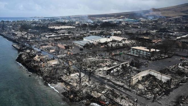 An aerial image taken on August 10, 2023 shows destroyed homes and buildings on the waterfront burned to the ground in Lahaina in the aftermath of wildfires in western Maui, Hawaii.