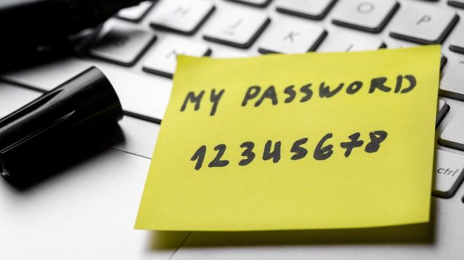 Password '12345678' written on a yellow note