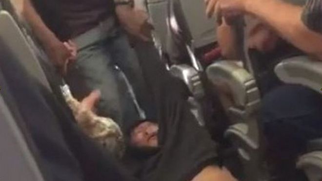 Passenger dragged off plane