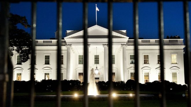 The White House is seen at dusk on the eve of a possible government shutdown as Congress battles out the budget in Washington, DC, September 30, 2013.