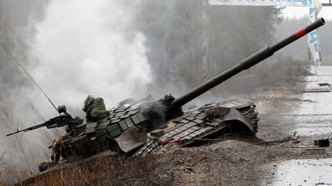 Russian tank destroyed by the Ukrainian forces on the side of a road in Lugansk region 26 February 2022