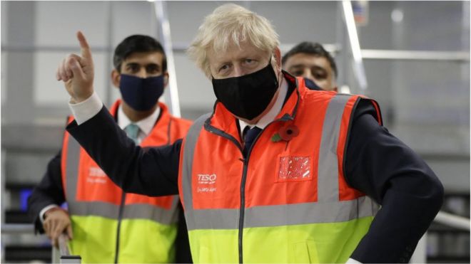 Prime Minister Boris Johnson alongside Chancellor of the Exchequer Rishi Sunak during a visit to the Tesco Erith distribution Centre in south east London.