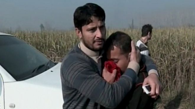 People react to the attack in Charsadda, Pakistan, 20 January
