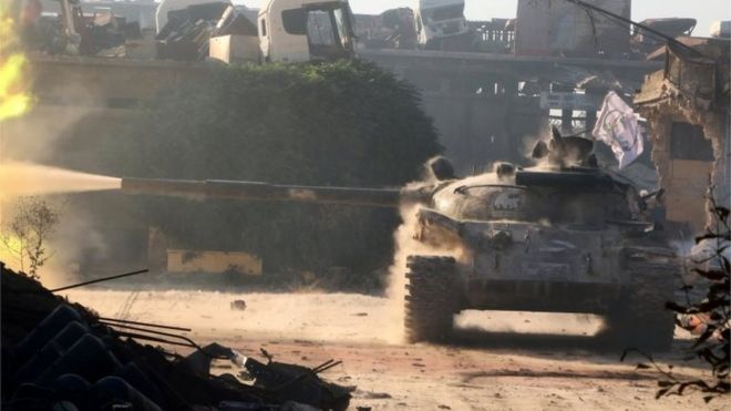 A Free Syrian Army tank fires in Ramousah area, southwest of Aleppo, Syria 02/08/2016