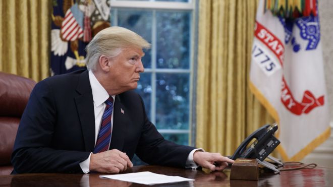 US President Donald J. Trump tries to connect the phone line with Mexican President Enrique Pena a Nieto to announce a trade deal in the Oval Office of the White House in Washington, DC, USA, 27 August 2018.