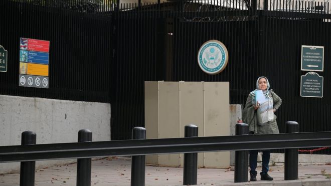 Woman waits at US embassy in Ankara