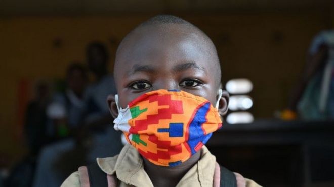 Boy wearing a colourful mask
