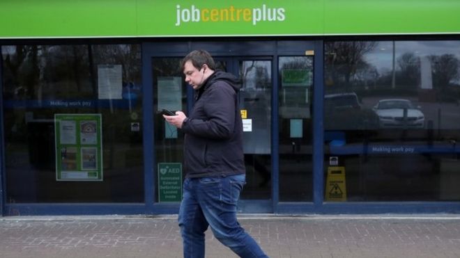 Man walks past job centre
