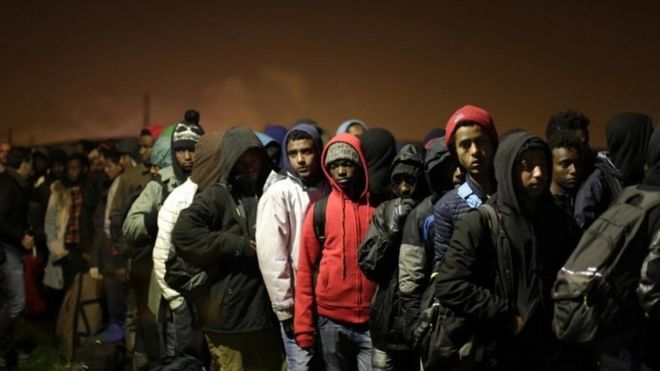 Migrants queue for Jungle reception points