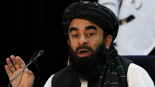 Taliban spokesman Zabihullah Mujahid announcing the new government