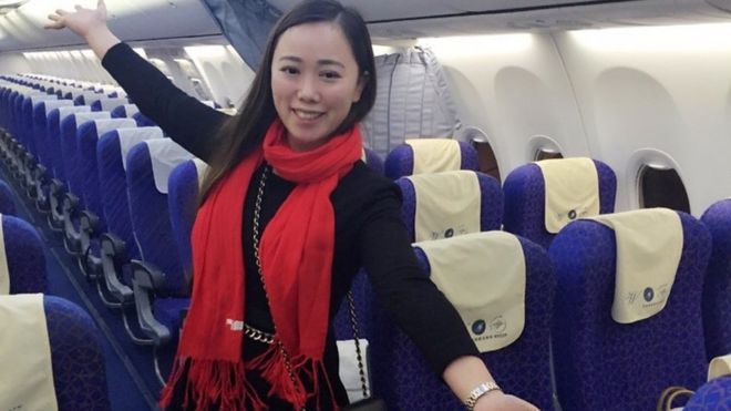 Ms Zhang poses in the empty cabin