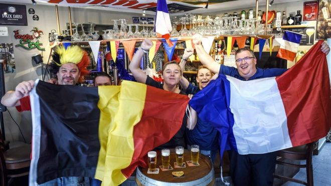 Belgian and French supporters gather at a cafe on July 9, 2018 near the French-Belgian border