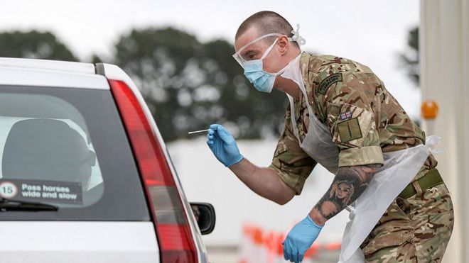 A soldier helps conducting COVID-19 testing for NHS key workers at a testing site in Plymouth