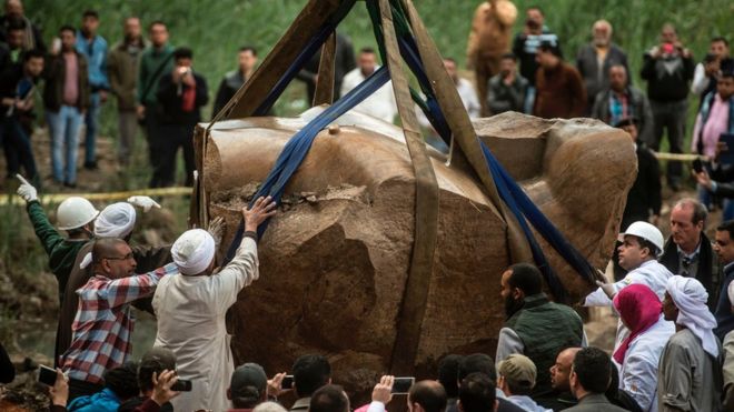 Egyptian workers excavate the statue, recently discovered by a team of German-Egyptian archeologists, in Cairo"s Mattarya district on March 13, 2017