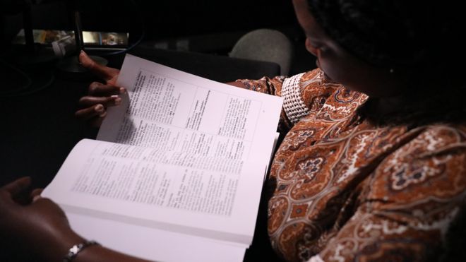 Person wey dey read book