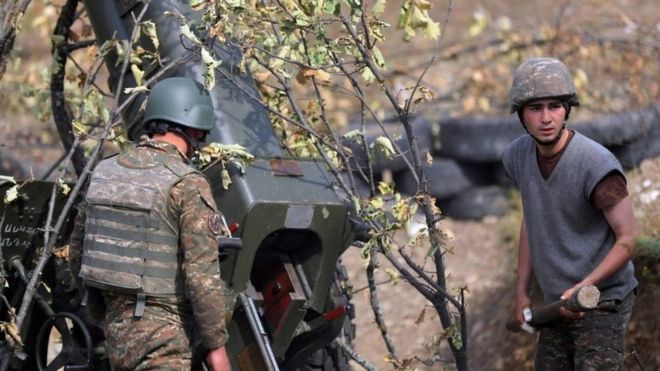 A picture provided by the Armenian Defence Ministry Press Office via PAN Photo shows Armenian soldiers fire during military combat with the Azerbaijani army in the Nagorno-Karabakh Republic