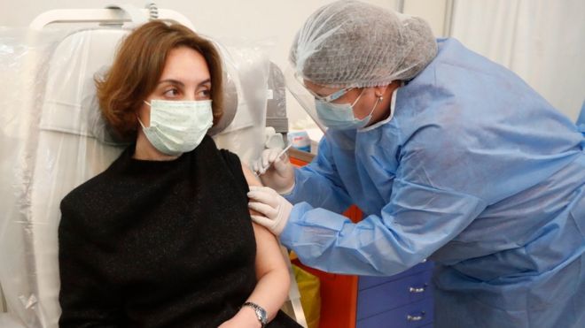 A woman receives a Oxford-AstraZeneca COVID-19 vaccine in Tbilisi, Georgia, 15 March 2020.