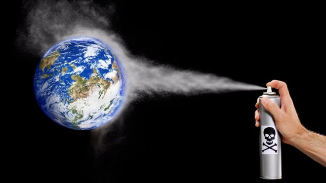 Aerosol contaminante apuntando al planeta Tierra