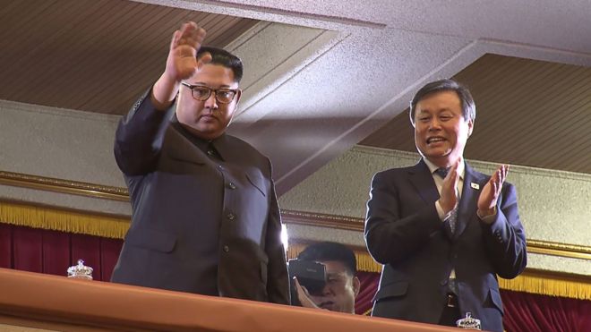 North Korean leader Kim Jong-un (L) and South Korean Culture, Sports and Tourism Minister Do Jong-hwan (R) during a rare concert by South Korean musicians at the 1,500-seat East Pyongyang Grand Theatre in Pyongyang on 1 April 2018